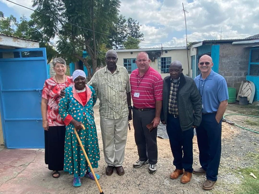 GIMI team visiting with Sammy Mbugua's mom