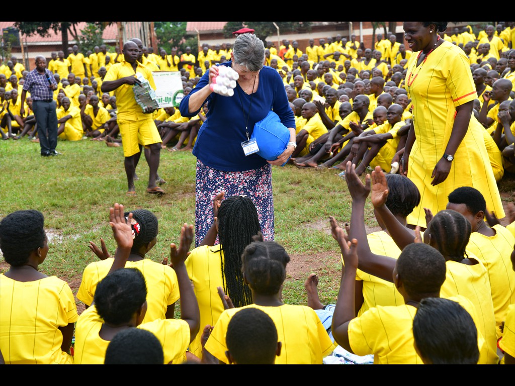 Sister Mildred bringing deoderant to lady prisoners in a Uganda prison